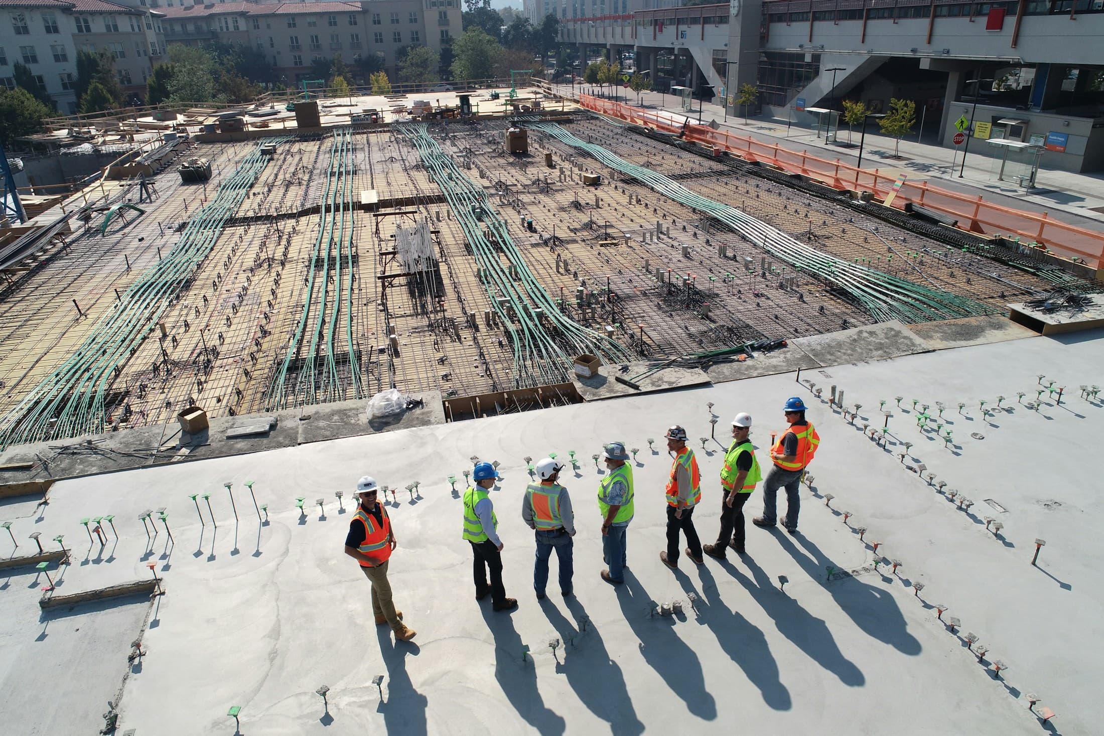 Construction crew reviewing work at an active building site