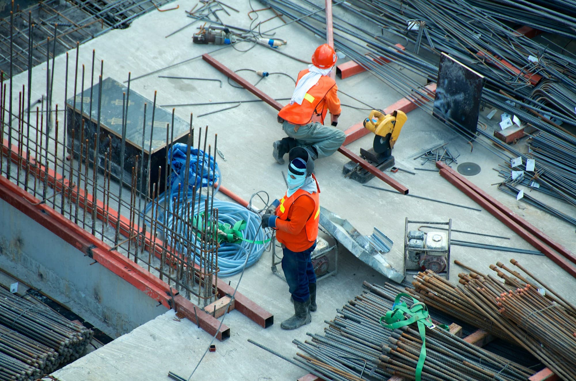 Crew wearing hard hats and high visibility clothing on a construction site